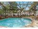 Relaxing screened-in pool with well-kept landscaping and lounge chairs at 3605 E Tampa Cir, Tampa, FL 33629
