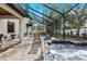 Screened in pool and jacuzzi, with chairs perfect for relaxing by the pool at 3605 E Tampa Cir, Tampa, FL 33629