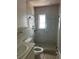 The full bathroom features a tiled shower and modern fixtures, perfect for relaxation at 3800 Belle Vista E Dr, St Pete Beach, FL 33706