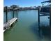 Waterfront view with private dock ready for boating, offering convenient water access at 3800 Belle Vista E Dr, St Pete Beach, FL 33706
