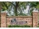 Bloomingdale Golfers Club entrance sign with brick pillars and lush green landscaping at 4614 River Overlook Dr, Valrico, FL 33596