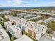 Aerial view of community showcases modern architecture and proximity to waterfront and roadway at 4810 W Mcelroy Ave # 7, Tampa, FL 33611