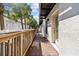 Outdoor walkway with wooden railing at 4810 W Mcelroy Ave # 7, Tampa, FL 33611