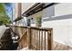 Outdoor walkway with wooden railing and a peaked metal awning at 4810 W Mcelroy Ave # 7, Tampa, FL 33611