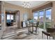 The dining area features a modern chandelier, large windows and great views at 4951 Bacopa S Ln # 801, St Petersburg, FL 33715