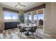 Chic dining room with modern table, stylish chairs, and picturesque waterfront views at 4951 Bacopa S Ln # 801, St Petersburg, FL 33715