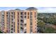 Condo exterior featuring multiple balconies, with easy access to parking, amenities, and views at 4951 Bacopa S Ln # 801, St Petersburg, FL 33715