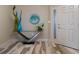 Inviting foyer featuring stylish decor, elegant tile flooring, and a secure entry door at 4951 Bacopa S Ln # 801, St Petersburg, FL 33715