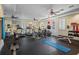 Well-equipped gym with treadmills, exercise bikes, weights, and ceiling fans for a complete workout experience at 4951 Bacopa S Ln # 801, St Petersburg, FL 33715