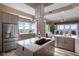 Gourmet kitchen featuring center island and granite countertops with water views at 4951 Bacopa S Ln # 801, St Petersburg, FL 33715