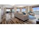 Spacious living room with modern furniture, stylish decor, and panoramic waterfront views at 4951 Bacopa S Ln # 801, St Petersburg, FL 33715
