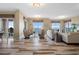 Bright living room with expansive windows, waterfront views, and modern, elegant furniture at 4951 Bacopa S Ln # 801, St Petersburg, FL 33715