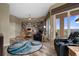 Spacious living room with wood floors, comfortable chairs, a ceiling fan, and ample natural light at 4951 Bacopa S Ln # 801, St Petersburg, FL 33715