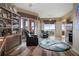 Bright living room with comfortable seating, a ceiling fan, and access to a scenic balcony at 4951 Bacopa S Ln # 801, St Petersburg, FL 33715