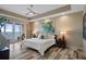 The main bedroom has a private balcony, tray ceiling, and water view at 4951 Bacopa S Ln # 801, St Petersburg, FL 33715