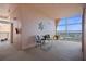 Condo patio with elegant seating, leaf wall decor, and a beautiful view of the city and the water at 4951 Bacopa S Ln # 801, St Petersburg, FL 33715