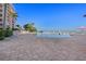 Relax by the community pool offering plenty of seating and palm trees, with beautiful bay views at 4951 Bacopa S Ln # 801, St Petersburg, FL 33715