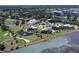 Waterfront condo overlooking a golf course, pond with fountain, and ocean views, unit highlighted in yellow at 50 Coe Rd # 223, Belleair, FL 33756