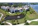 Beautiful waterfront condos featuring a pond with fountain and golf course views, unit highlighted in yellow at 50 Coe Rd # 223, Belleair, FL 33756