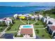 Aerial view of waterfront condos with pool, showing location indicated by arrow at 50 Coe Rd # 223, Belleair, FL 33756