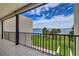Outdoor balcony with stunning views of the water and lush landscaping at 50 Coe Rd # 223, Belleair, FL 33756