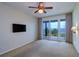 Bedroom with sliding glass doors leading to balcony overlooking a view of the water at 50 Coe Rd # 223, Belleair, FL 33756