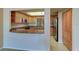Well-lit kitchen featuring wooden cabinets, granite countertops and stainless steel appliances at 50 Coe Rd # 223, Belleair, FL 33756