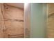 Shower with glass doors and tan tile at 50 Coe Rd # 223, Belleair, FL 33756