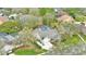 An aerial view of the property shows the screened-in pool and spacious lot at 503 Old Grove Dr, Lutz, FL 33548