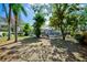 A shaded view of a screened-in pool and spacious backyard at 503 Old Grove Dr, Lutz, FL 33548