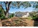 Spacious, shaded backyard featuring a screened-in pool and privacy at 503 Old Grove Dr, Lutz, FL 33548