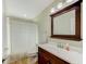 This bathroom features a large mirror and a combination tub/shower at 503 Old Grove Dr, Lutz, FL 33548