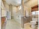Bathroom featuring a shower, tub, toilet, and window with brown shade at 503 Old Grove Dr, Lutz, FL 33548