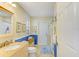 Well-lit bathroom with granite countertops, neutral color scheme, and a glass-enclosed shower at 503 Old Grove Dr, Lutz, FL 33548