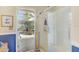 Glass shower door view to the back lanai at 503 Old Grove Dr, Lutz, FL 33548