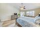 Bedroom with wooden floors, large windows, and an exterior door at 503 Old Grove Dr, Lutz, FL 33548