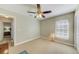 Neutral bedroom includes ceiling fan and closet at 503 Old Grove Dr, Lutz, FL 33548