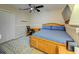 Cozy bedroom with a comfortable bed, desk, and carpeted floor at 503 Old Grove Dr, Lutz, FL 33548