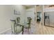 Dining room with glass table and green upholstered chairs at 503 Old Grove Dr, Lutz, FL 33548