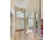 Bright entryway featuring high ceilings, neutral paint, and luxury vinyl plank flooring at 503 Old Grove Dr, Lutz, FL 33548