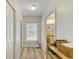 Hallway with storage leading to a bathroom at 503 Old Grove Dr, Lutz, FL 33548