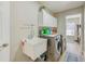Convenient laundry room with modern washer and dryer and utility sink at 503 Old Grove Dr, Lutz, FL 33548