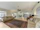 Open floor plan showcasing the living room, dining area, and kitchen with ample natural light at 503 Old Grove Dr, Lutz, FL 33548