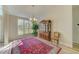 Bright living room with a large window, wooden furniture, and a decorative rug at 503 Old Grove Dr, Lutz, FL 33548