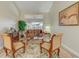 Cozy living room with comfortable seating, a decorative rug, and a view of the backyard at 503 Old Grove Dr, Lutz, FL 33548