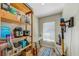 Storage area with shelving, vacuum and ironing board at 503 Old Grove Dr, Lutz, FL 33548