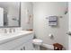 Bathroom featuring a white vanity with framed mirror, and a towel rack with striped towels at 5351 Bridge St # 41, Tampa, FL 33611