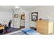 Bedroom featuring a ceiling fan and dresser and diplomas and sports memorabilia on walls at 5351 Bridge St # 41, Tampa, FL 33611