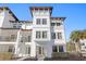 Bright and modern three-story townhome with eye-catching architectural features, including a tower and balconies at 5351 Bridge St # 41, Tampa, FL 33611