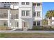 Inviting townhouse with a cozy balcony, classic white exterior, and meticulously maintained grounds at 5351 Bridge St # 41, Tampa, FL 33611